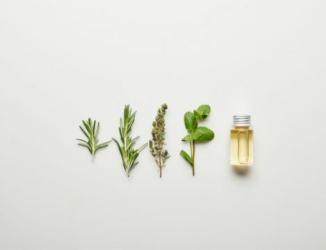 top-view-of-essential-oil-in-bottle-and-fresh-herb-2021-08-30-01-47-54-utc 1
